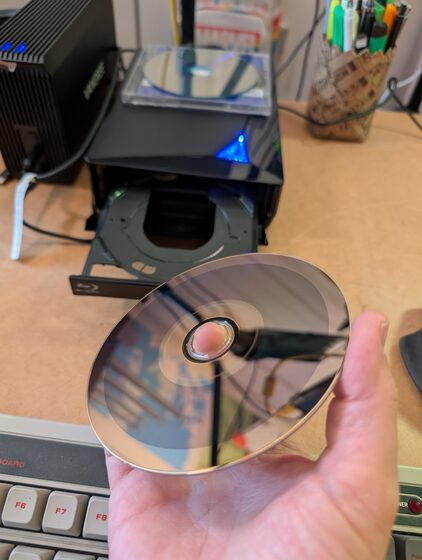 MDisc disc close-up showing the distinctive stone layer